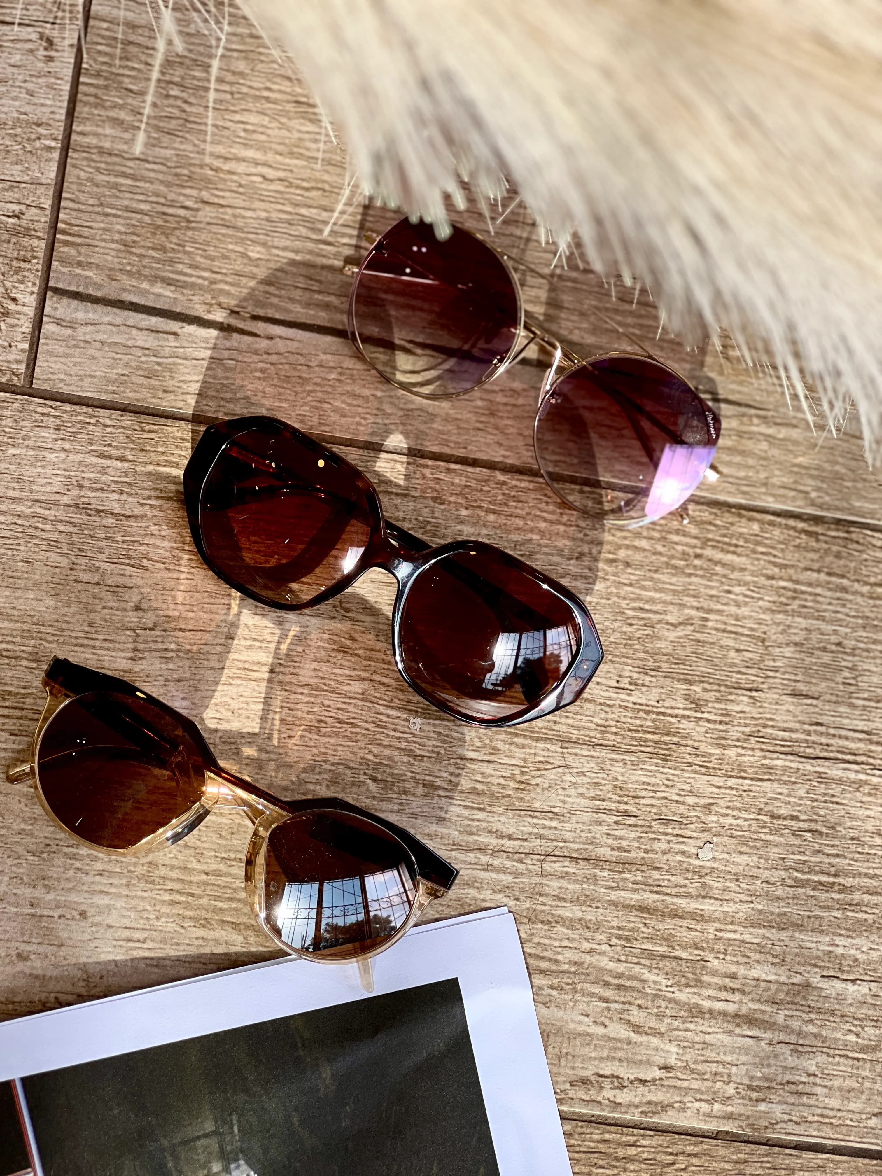 Sunglasses on wooden surface