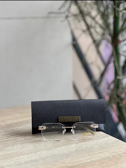 Sunglasses on red surface