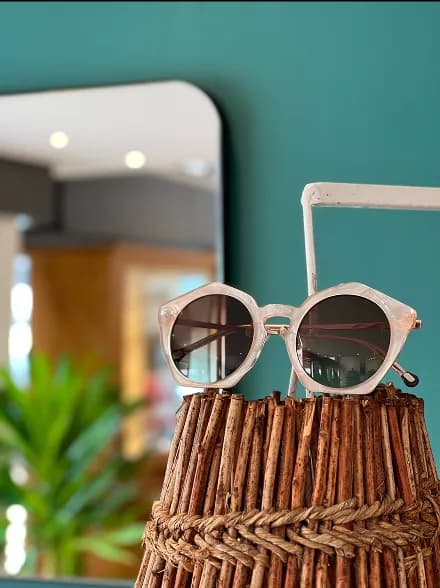 Sunglasses on red surface