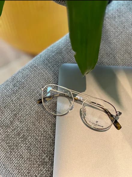 Sunglasses on red surface