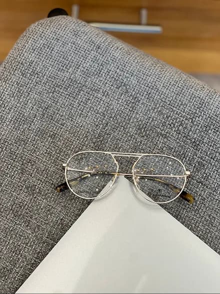 Sunglasses on red surface
